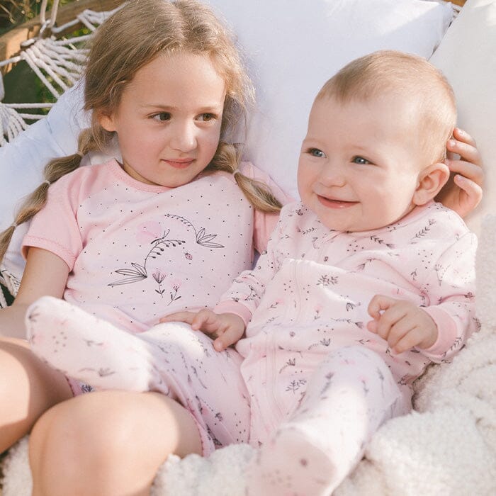 Siblings in matching family pajamas