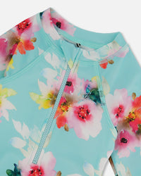 Printed One-Piece Rashguard With Frills Turquoise And Pink Flowers Swimwear Deux par Deux 