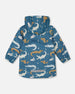 Blue Raincoat With Crocodiles That Change Color Upon Contact With Water