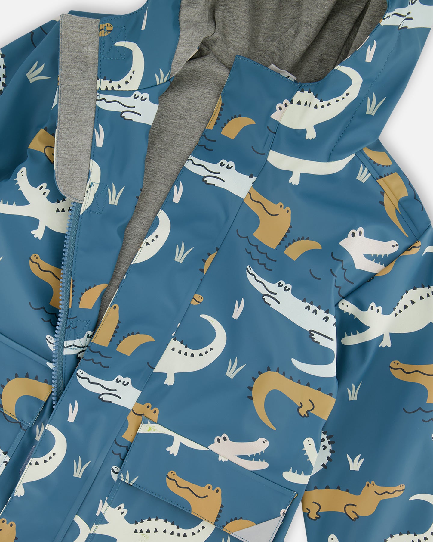 Blue Raincoat With Crocodiles That Change Color Upon Contact With Water