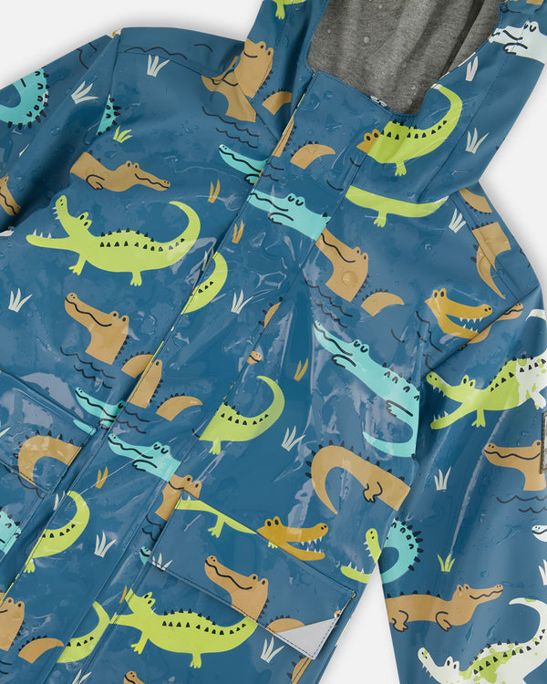 Blue Raincoat With Crocodiles That Change Color Upon Contact With Water