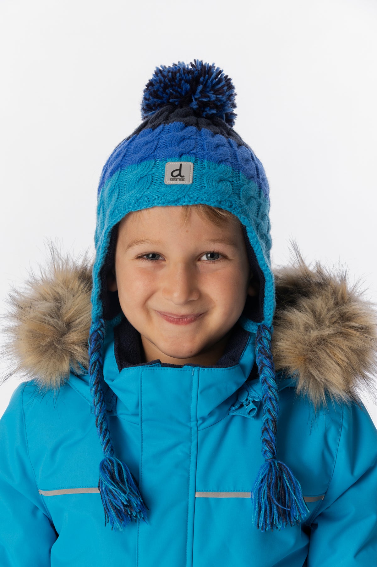 Bonnet d'hiver péruvien en tricot avec pompom bleu foncé