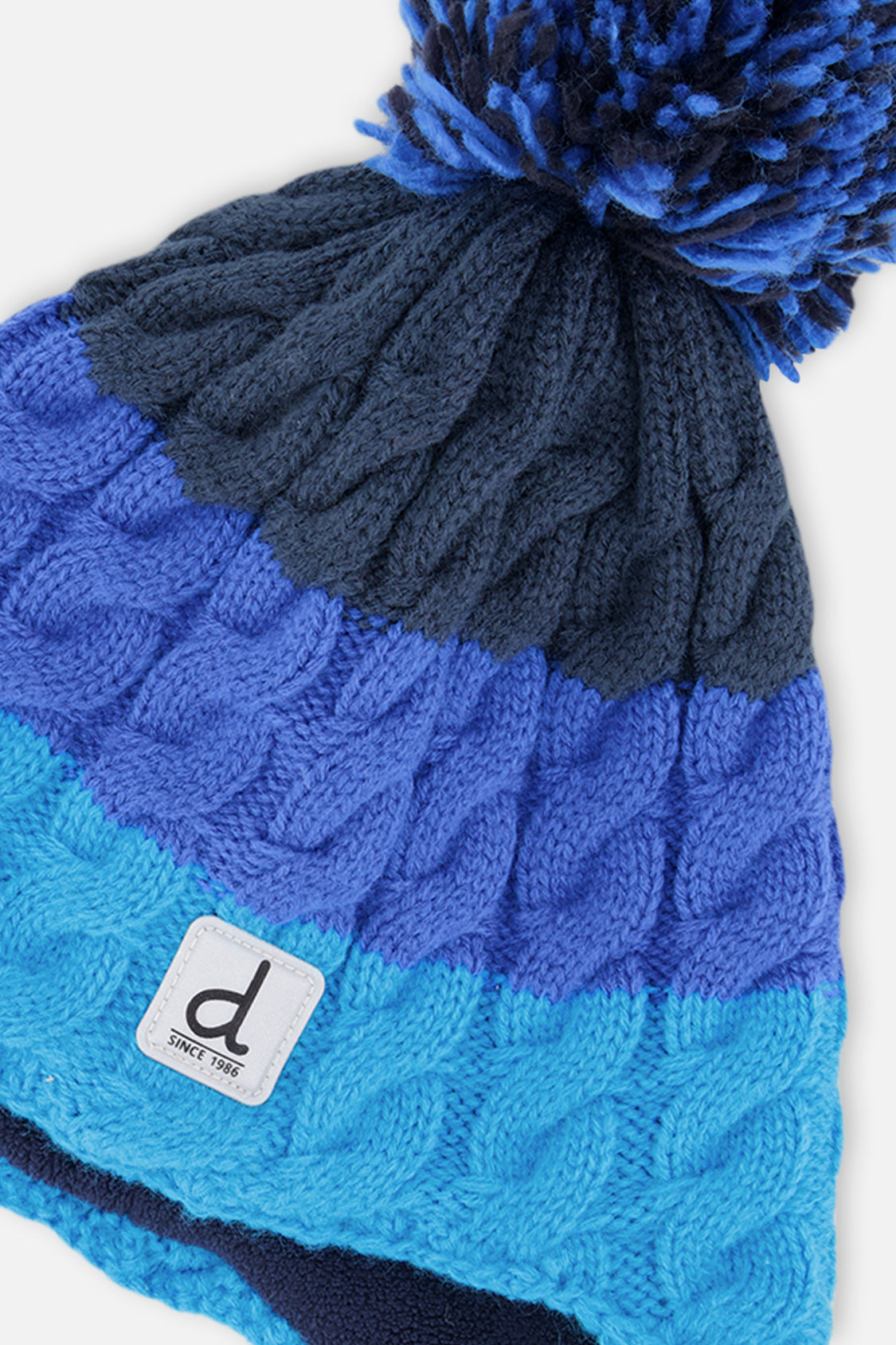 Bonnet d'hiver péruvien en tricot avec pompom bleu foncé