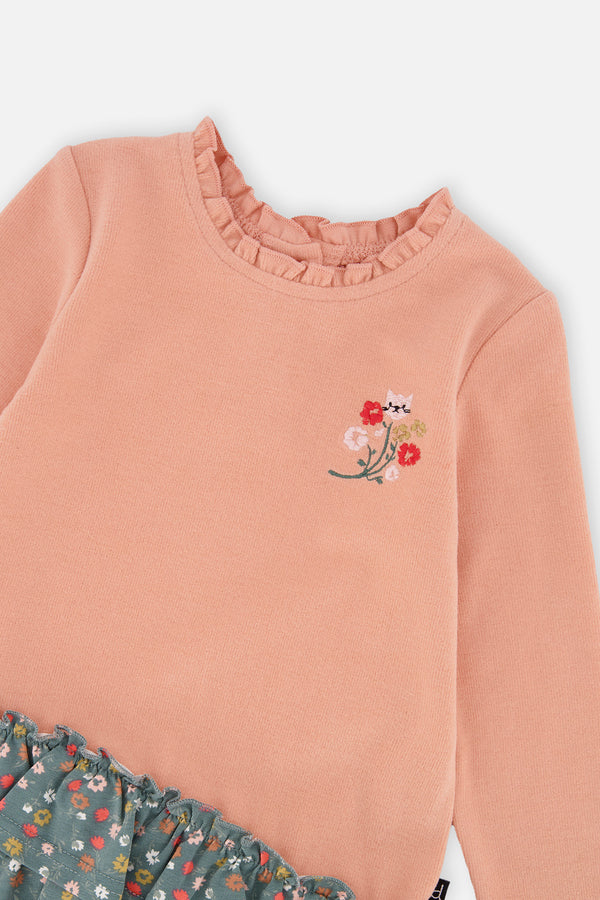 Baby-Kleid aus zwei Materialien in Blassrosa mit grünem Blumenmuster